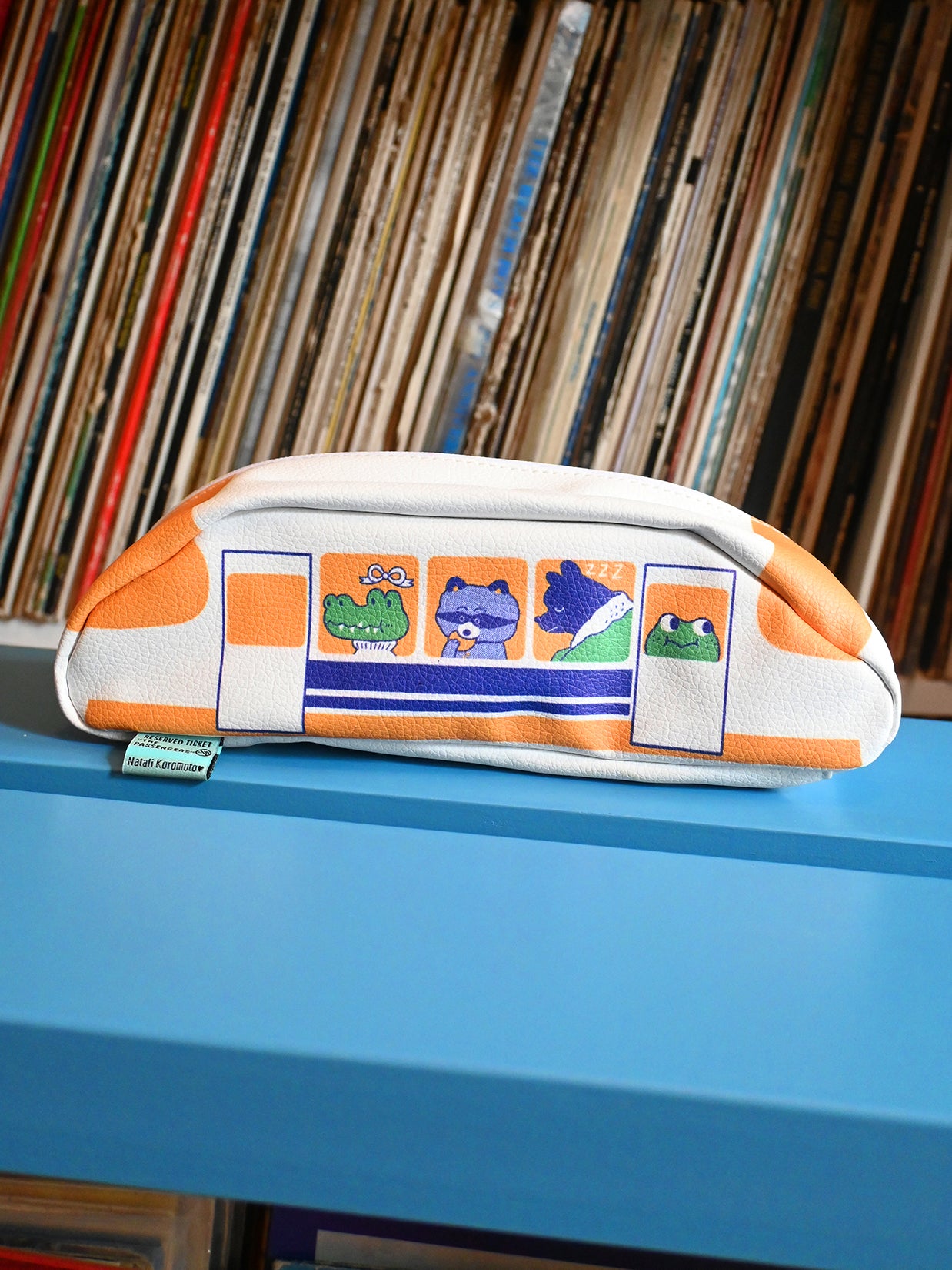 "Passengers" pencil pouch by Natali Koromoto showing full side view with animal characters enjoying their adventure on the Shinkansen bullet train.
