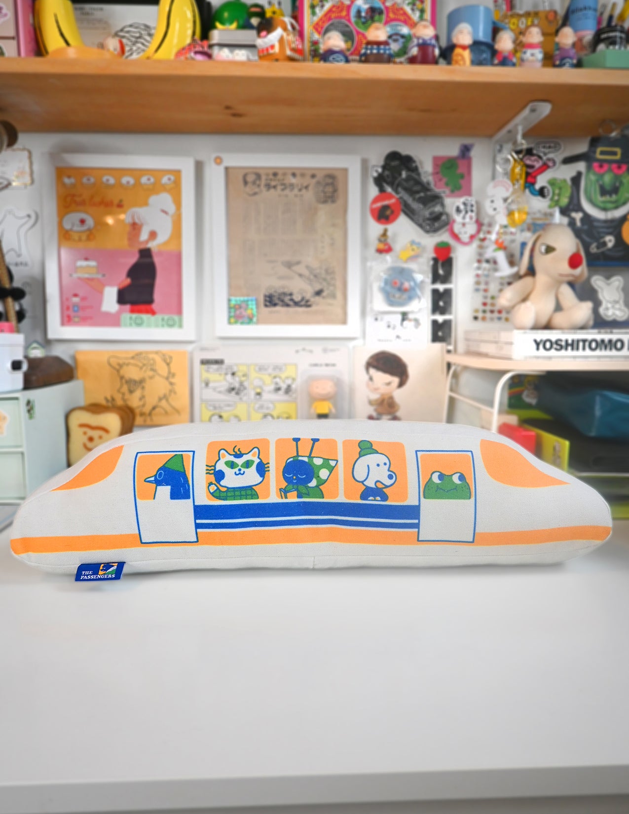 "The Passengers" throw pillow by Natali Koromoto. Showing full side view with animal characters enjoying their adventure on the Shinkansen bullet train.
